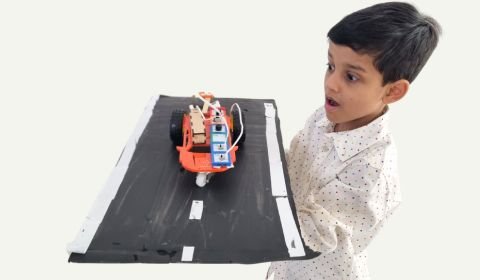 kid with robotics project